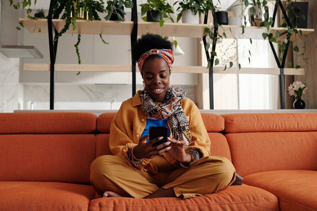 Guest verifying identity on phone in a modern apartment